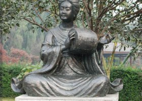 公園打腰鼓的古代人物銅雕 